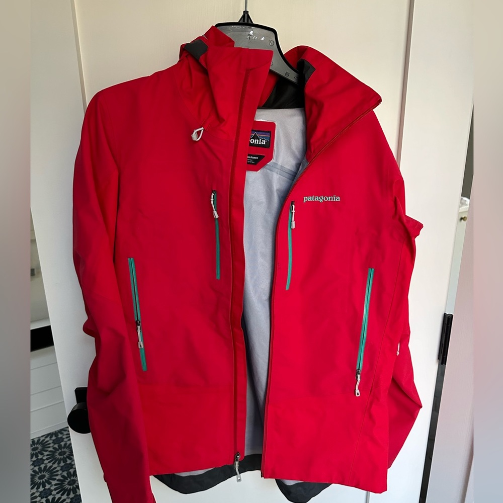 Patagonia Women’s performance raincoat in red and turquoise. Size L